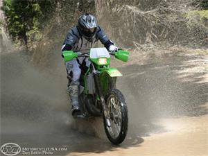 BC flocks to water like a duck. Here is tries to ski the KDX across a massive puddle during late spring.